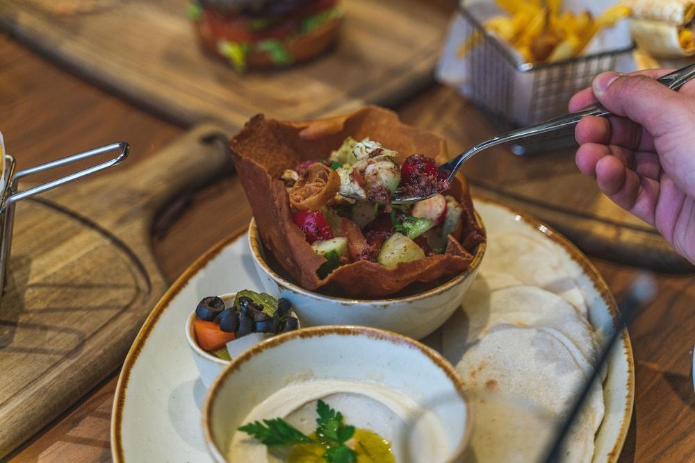 Doubletree By Hilton Doha - Al Sadd Hotel Ngoại thất bức ảnh A Greek salad served in a pita